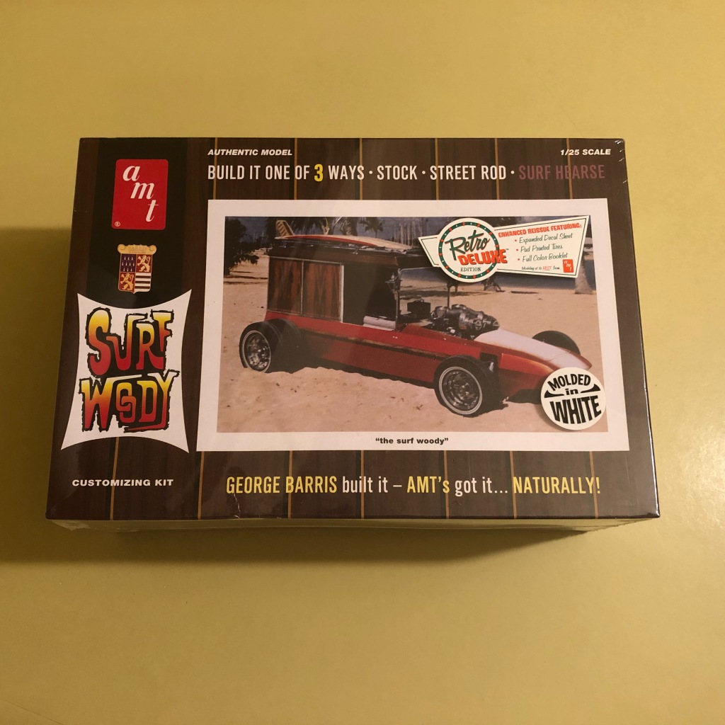 A box for a plastic model kit showing a photo of a show rod: the Surf Woody designed by Tom Daniel and built by George Barris.