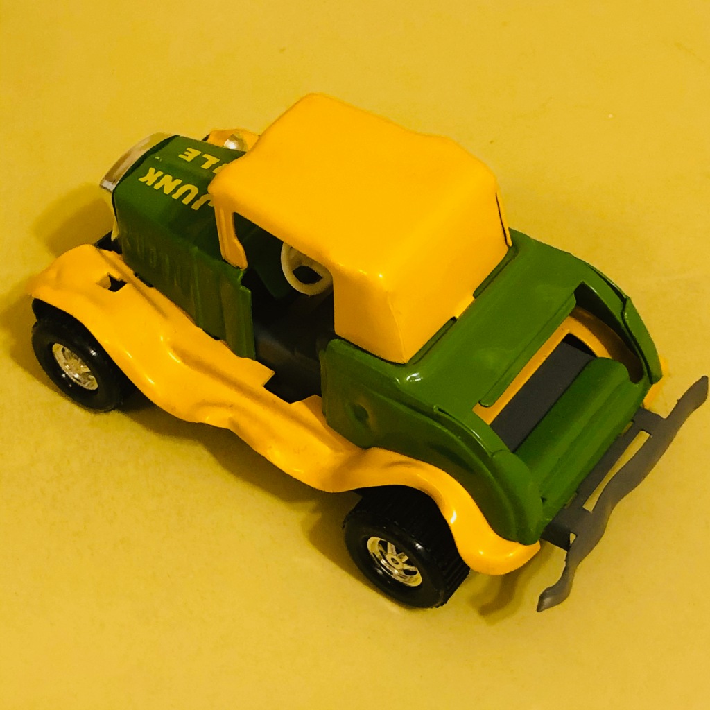 A toy car by Topper Toys called the Zoomer-Boomer Junk Pile. It is a show rod or cartoon car.
