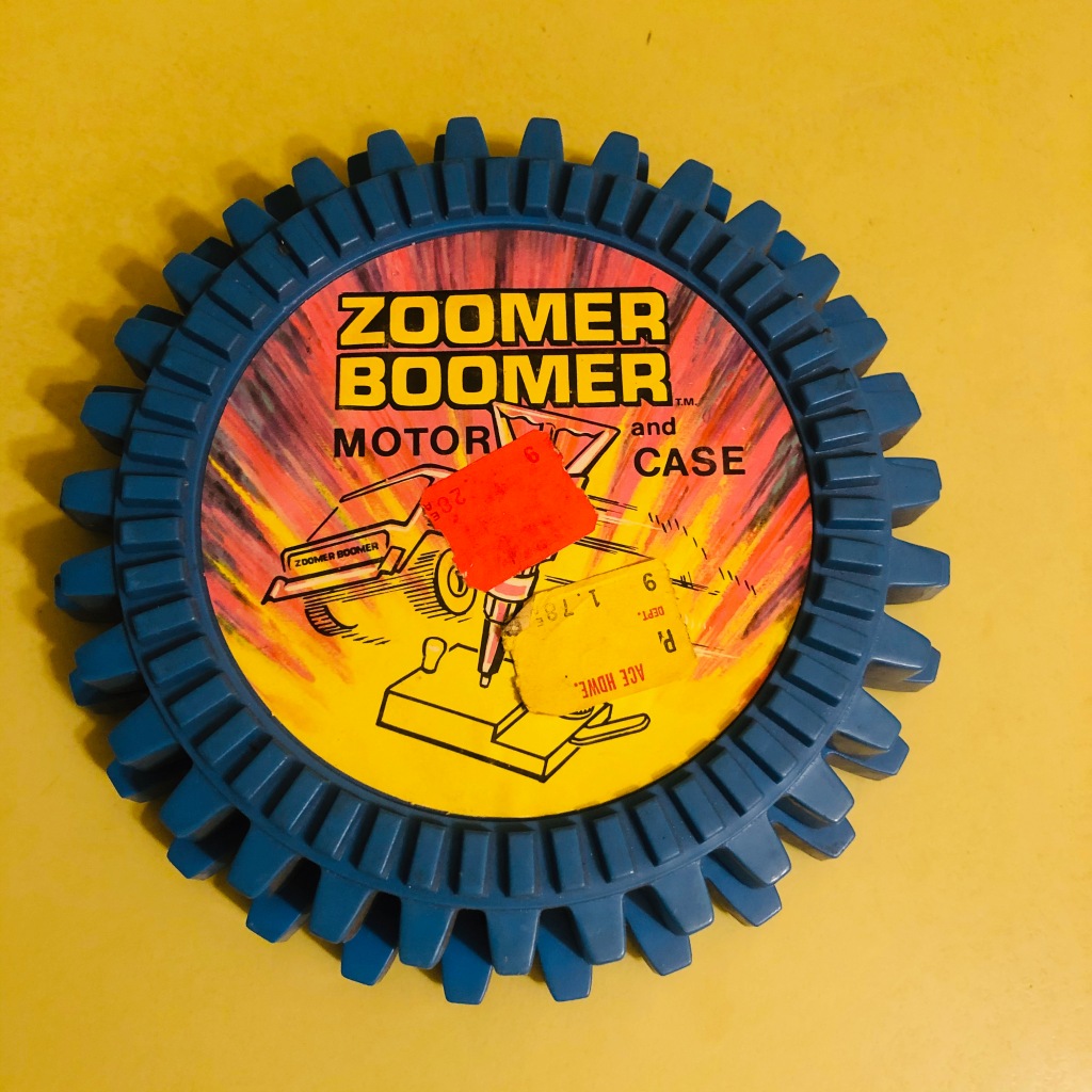 A Topper Toys Zoomer-Boomer Motor and Case, closed.