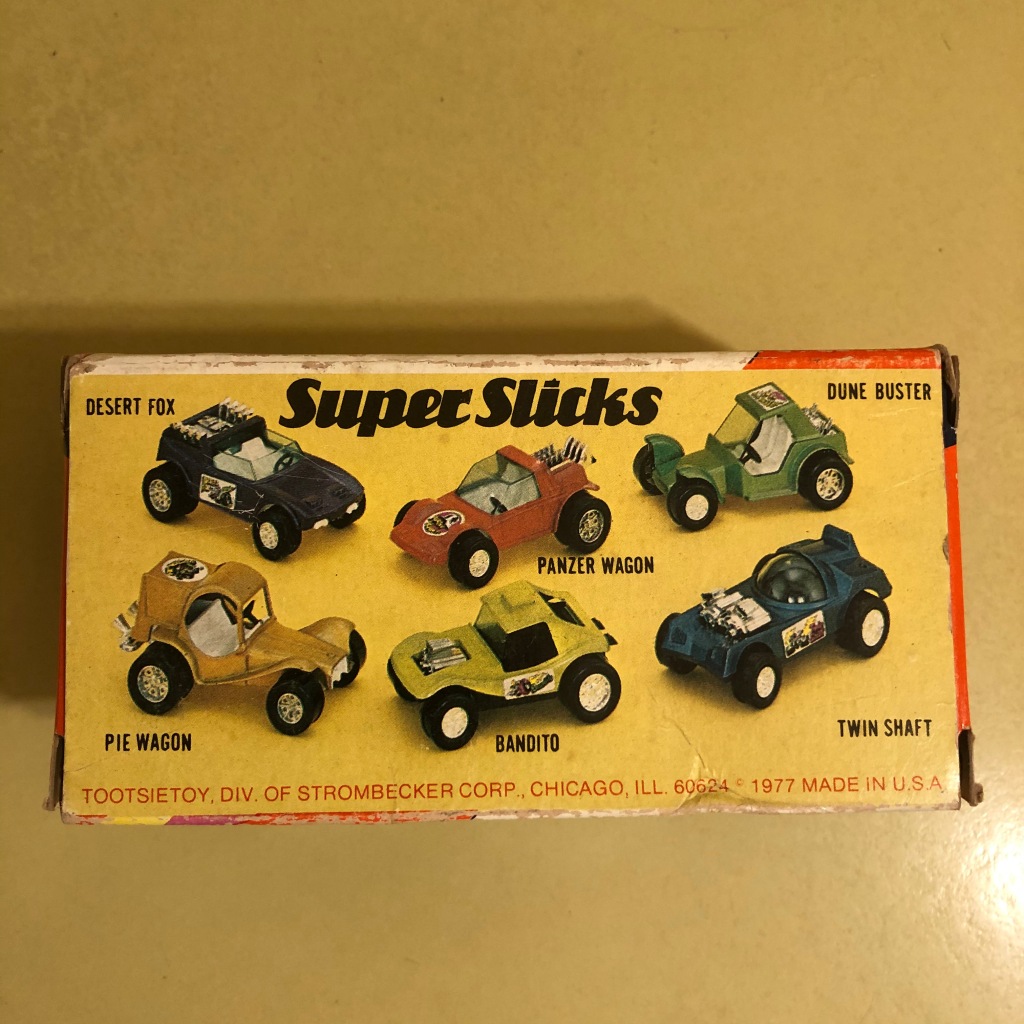 The bottom panel of the display box shows the six Super Slicks cars.